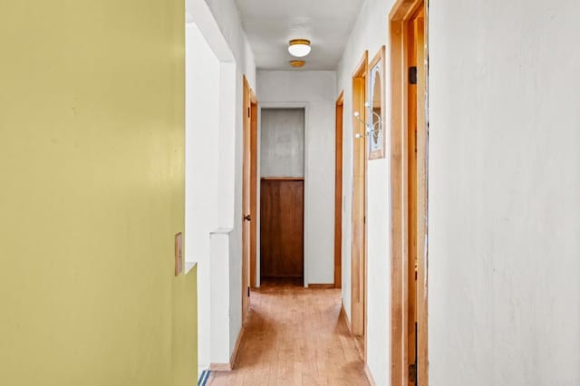 hall with light wood-type flooring