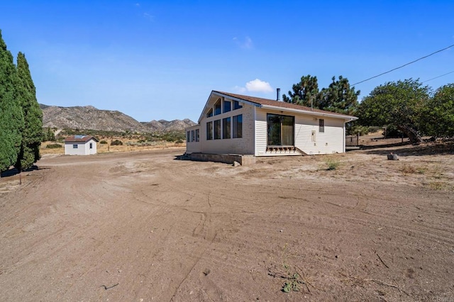 view of front of home with a mountain view