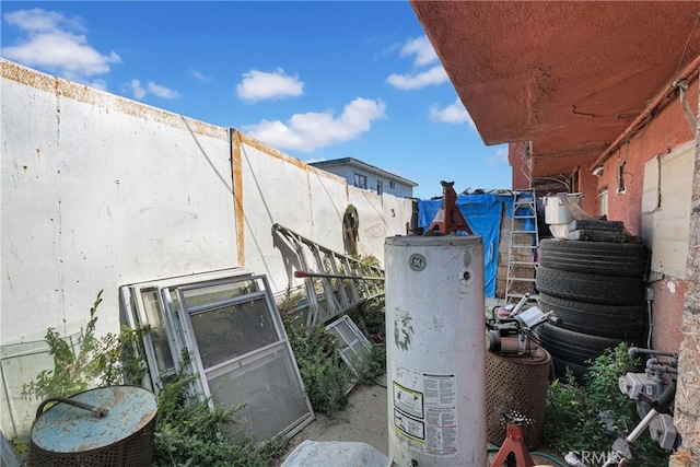 exterior details with water heater and concrete floors