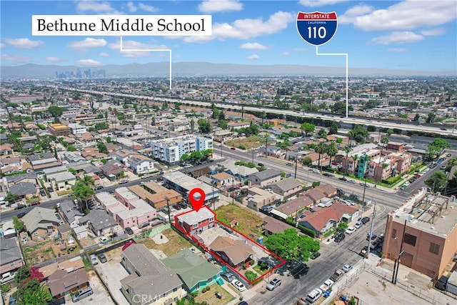 birds eye view of property featuring a mountain view