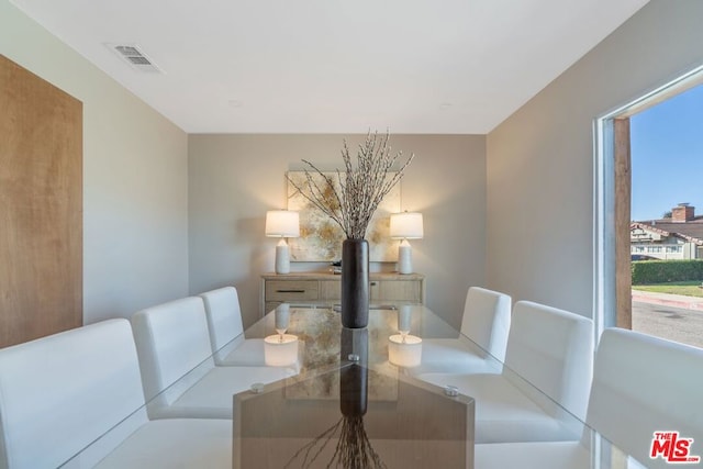 dining space featuring plenty of natural light