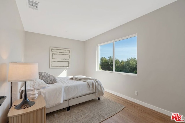 bedroom featuring wood-type flooring