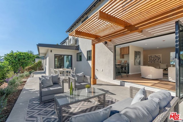 view of patio / terrace featuring an outdoor living space and a pergola