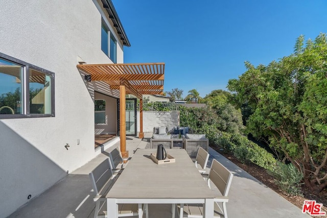 view of patio featuring a pergola and outdoor lounge area