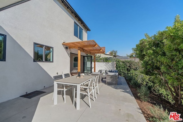 view of patio with an outdoor living space and a pergola