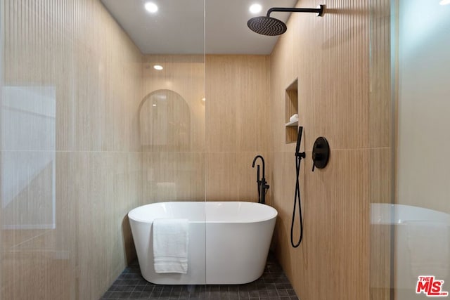 bathroom with tile patterned floors and plus walk in shower