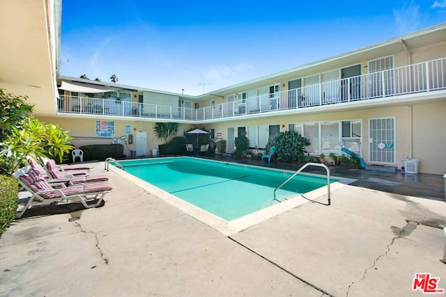 view of pool featuring a patio