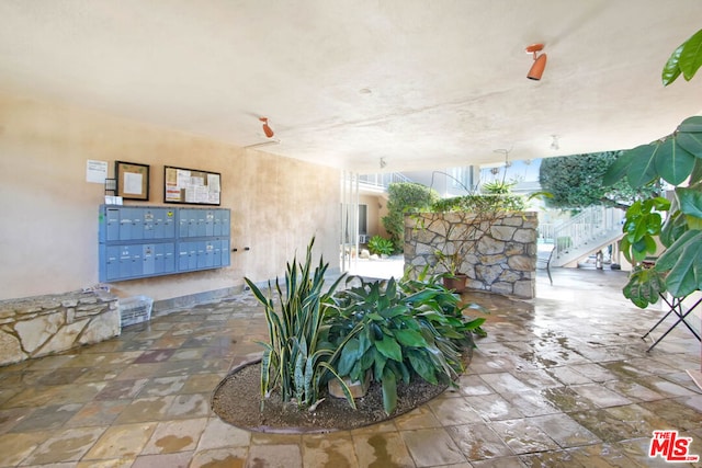 view of patio featuring a mail area