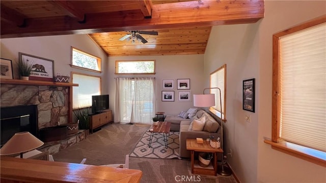 carpeted living room featuring ceiling fan, vaulted ceiling with beams, wood ceiling, and a fireplace