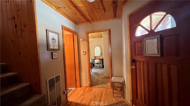 foyer with wooden ceiling and hardwood / wood-style floors