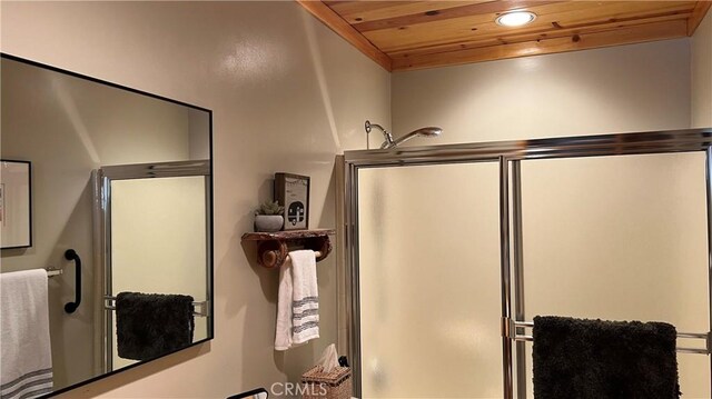 bathroom with wooden ceiling and walk in shower