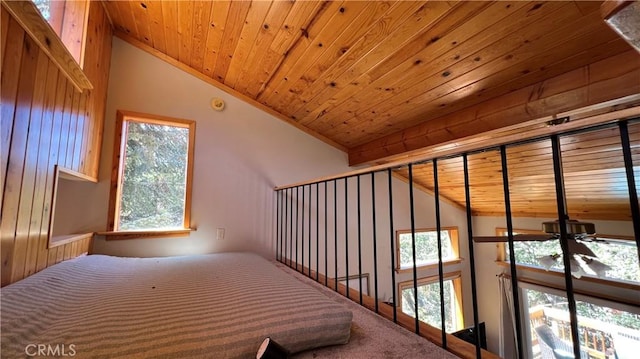 unfurnished bedroom with vaulted ceiling, wood ceiling, and multiple windows