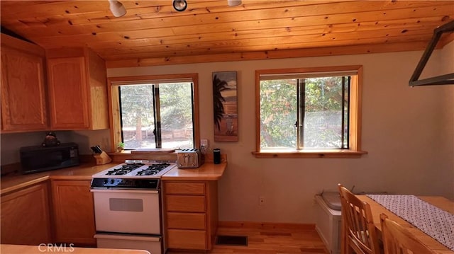 kitchen featuring wooden ceiling, white range with gas stovetop, and light hardwood / wood-style flooring