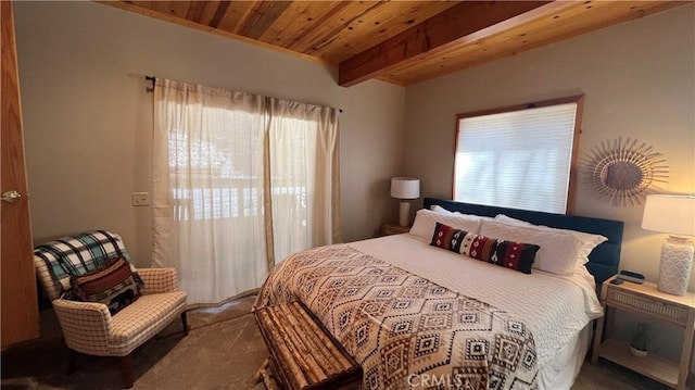 carpeted bedroom featuring wooden ceiling and beamed ceiling