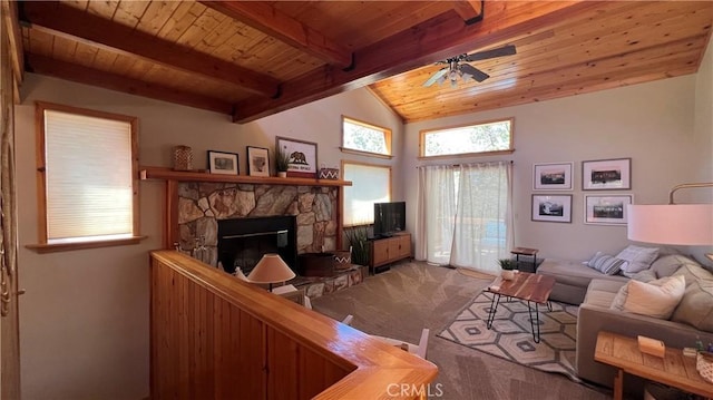 living room featuring wood ceiling, ceiling fan, carpet, a fireplace, and beam ceiling