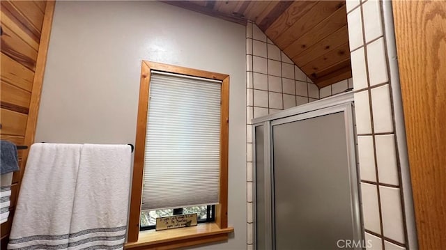 bathroom featuring wooden ceiling, lofted ceiling, and an enclosed shower