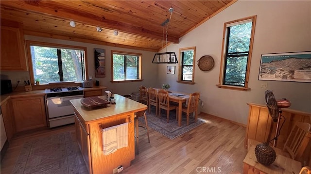 kitchen featuring wood ceiling, a kitchen island, decorative light fixtures, white stove, and light wood-type flooring