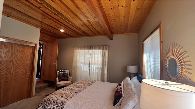 carpeted bedroom with beamed ceiling and wood ceiling