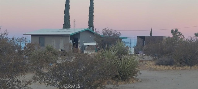 view of property exterior at dusk