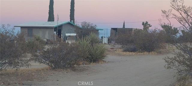 view of property exterior at dusk