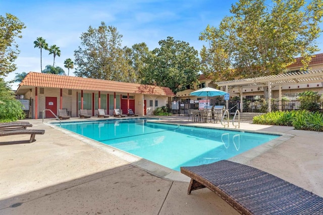 view of swimming pool featuring a patio area