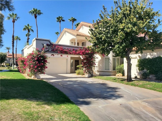 mediterranean / spanish-style home featuring a front lawn