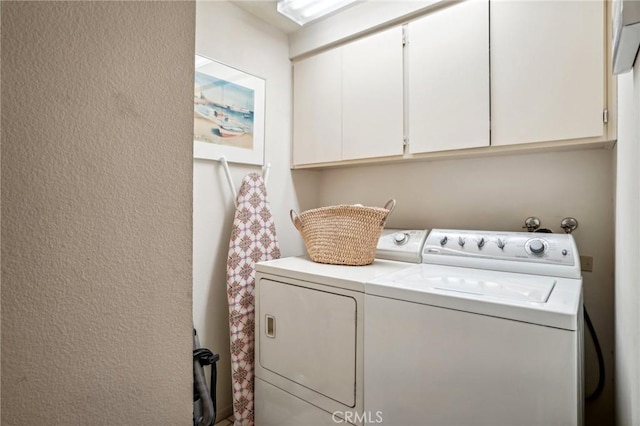 laundry area with cabinets and independent washer and dryer