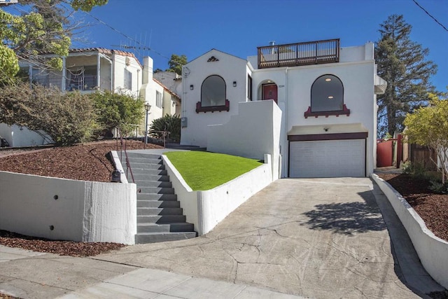 mediterranean / spanish-style house featuring a balcony and a garage