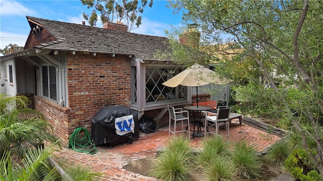 view of patio featuring a grill