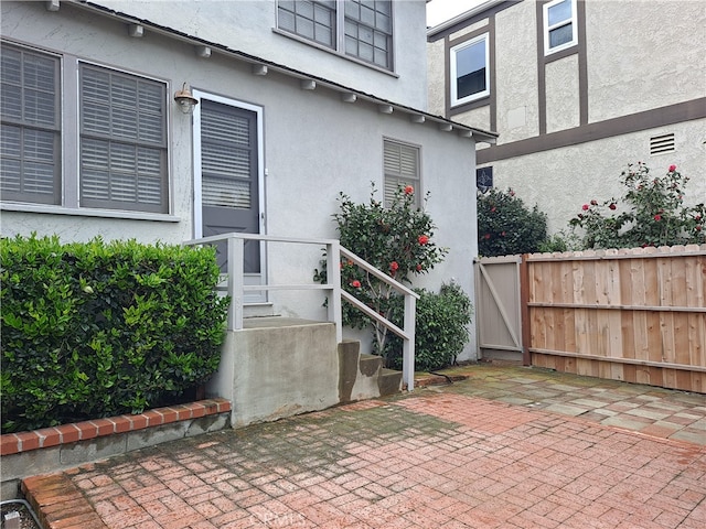 property entrance with a patio area