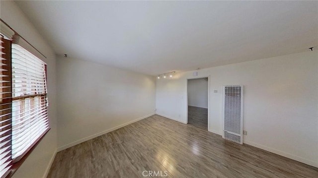 unfurnished room featuring hardwood / wood-style floors