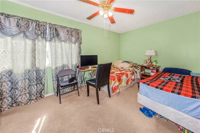 bedroom with ceiling fan and carpet floors