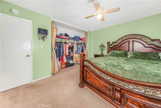 bedroom featuring a closet, ceiling fan, and light carpet