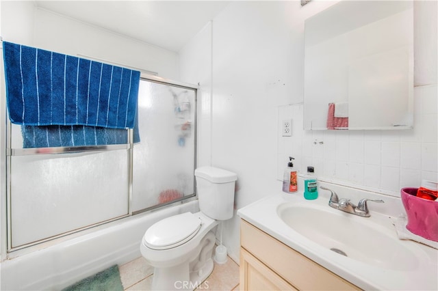 full bathroom featuring backsplash, toilet, enclosed tub / shower combo, vanity, and tile patterned flooring