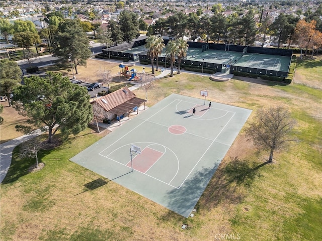 view of sport court featuring a yard