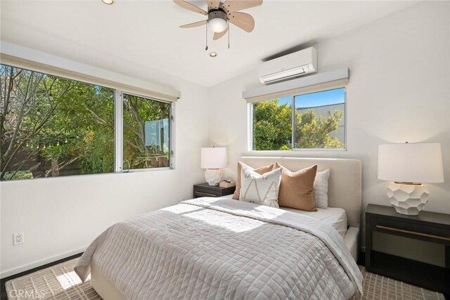 bedroom with an AC wall unit