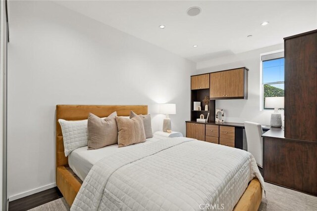 bedroom featuring dark hardwood / wood-style floors