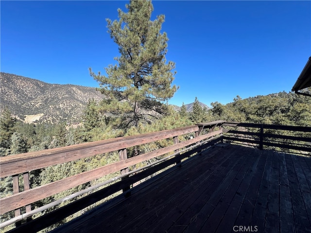 wooden terrace with a mountain view