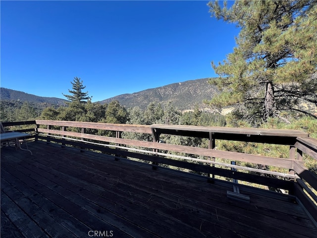 wooden terrace with a mountain view