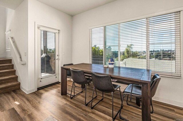 dining room with dark hardwood / wood-style flooring