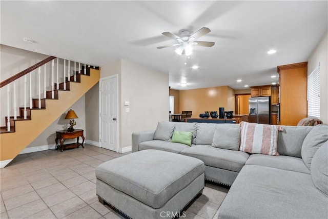 living room with ceiling fan and light tile patterned floors