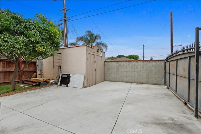 view of patio with a storage unit