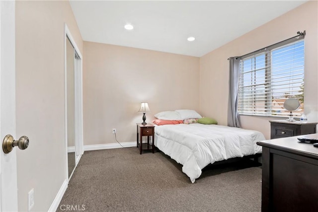 carpeted bedroom with a closet