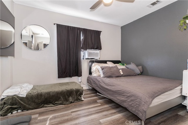 bedroom featuring ceiling fan and hardwood / wood-style flooring