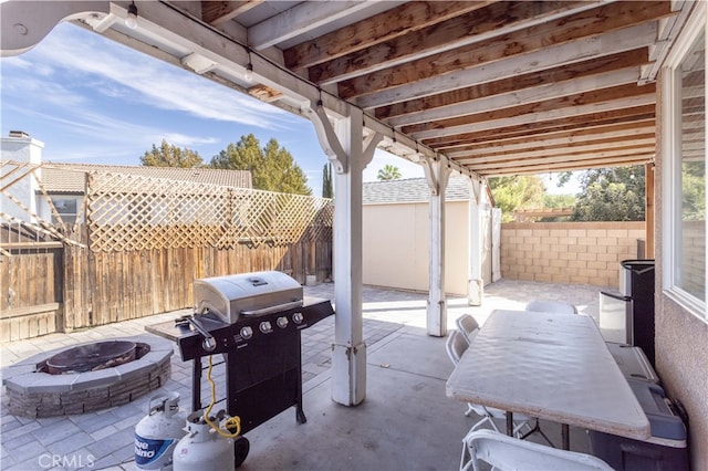 view of patio / terrace featuring an outdoor fire pit and a grill