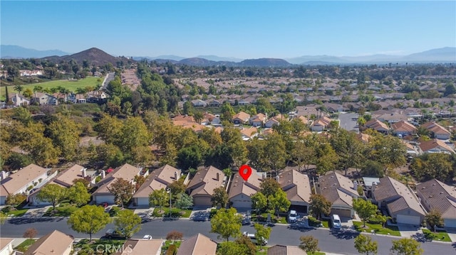 birds eye view of property with a mountain view