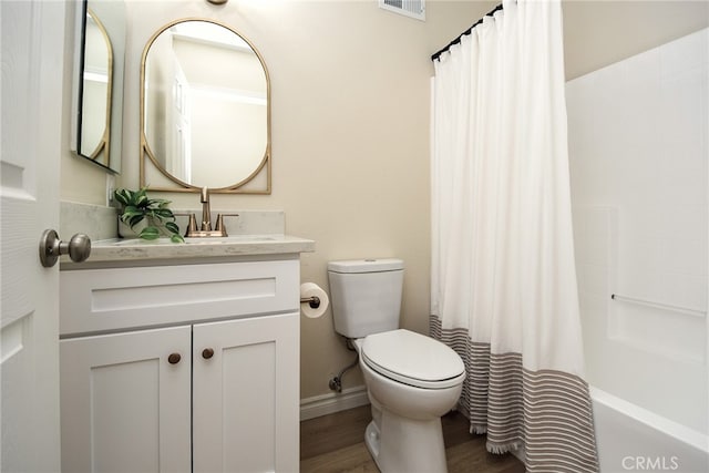 full bathroom with vanity, toilet, wood-type flooring, and shower / bath combination with curtain