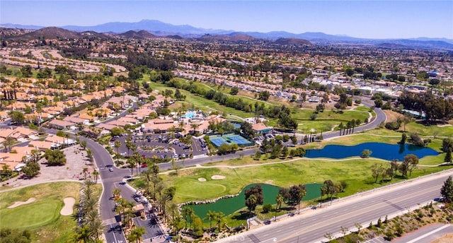 birds eye view of property with a water and mountain view