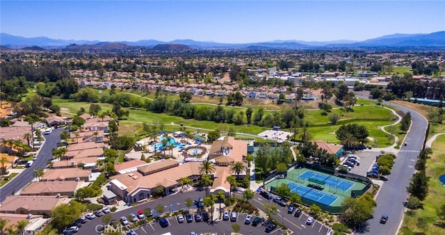 birds eye view of property with a mountain view