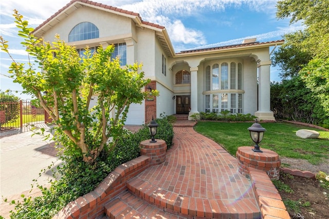 property entrance with a yard and a garage